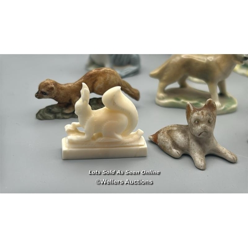 160 - Miniature animal figurines including ceramic Dogs, Seal, Penguin and Deer, with a white carved stone... 