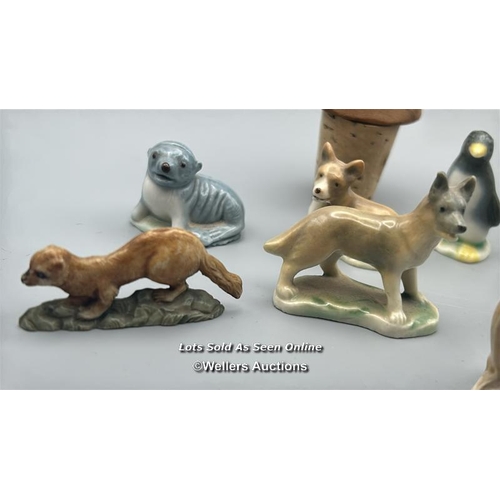 160 - Miniature animal figurines including ceramic Dogs, Seal, Penguin and Deer, with a white carved stone... 