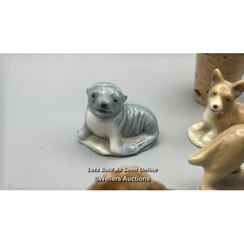 160 - Miniature animal figurines including ceramic Dogs, Seal, Penguin and Deer, with a white carved stone... 