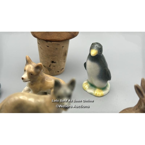 160 - Miniature animal figurines including ceramic Dogs, Seal, Penguin and Deer, with a white carved stone... 