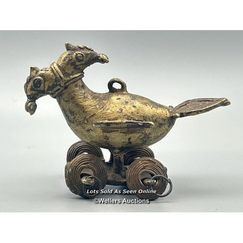 166 - A Hindu temple toy in the form of a bird with two heads, brass with dhokra cast wheels, 5.5cm high w... 