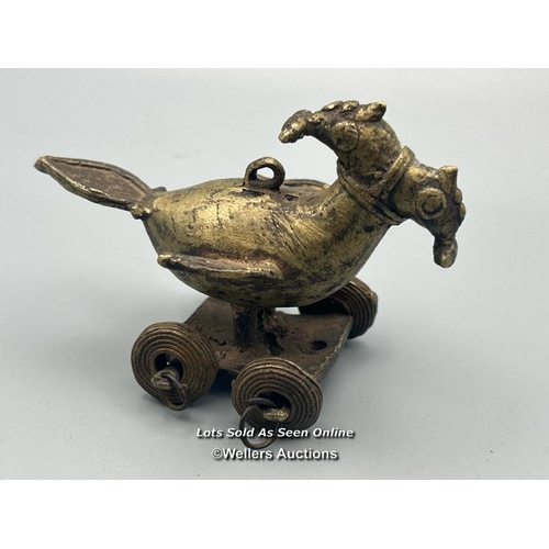 166 - A Hindu temple toy in the form of a bird with two heads, brass with dhokra cast wheels, 5.5cm high w... 