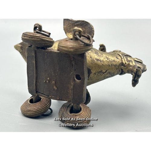 166 - A Hindu temple toy in the form of a bird with two heads, brass with dhokra cast wheels, 5.5cm high w... 