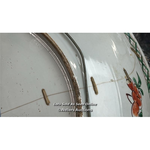 172 - A Chinese famille verte porcelain charger decorated with two long tailed birds, one in flight and th... 