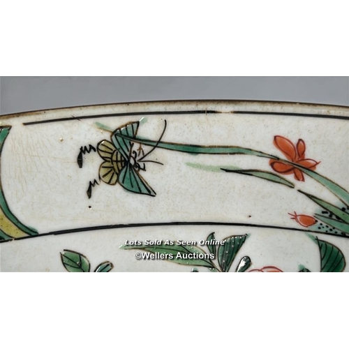 172 - A Chinese famille verte porcelain charger decorated with two long tailed birds, one in flight and th... 