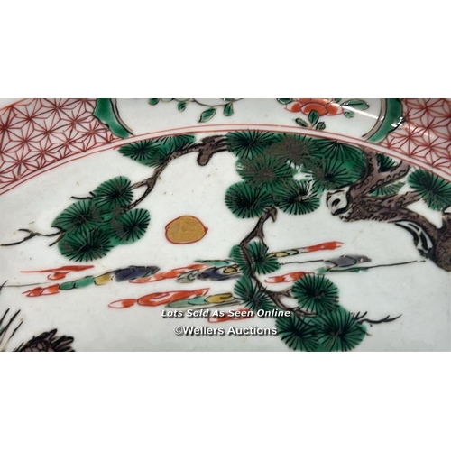 173 - A Chinese Kangxi famille verte porcelain charger painted with a spotted Deer and Crane with tree and... 