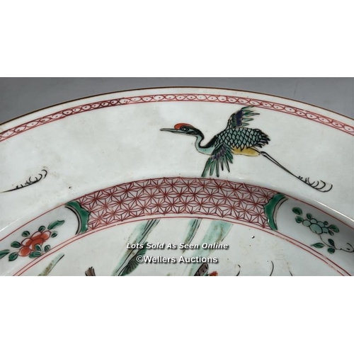 173 - A Chinese Kangxi famille verte porcelain charger painted with a spotted Deer and Crane with tree and... 