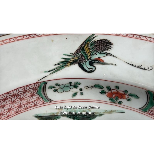 173 - A Chinese Kangxi famille verte porcelain charger painted with a spotted Deer and Crane with tree and... 