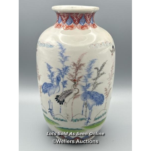 174 - A near pair of oriental porcelain famille verte vases decorated with Cranes one larger than the othe... 