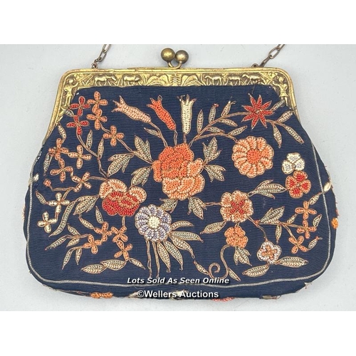 182 - Two vintage evening purses, one with embroidered flowers and metal clasp decorated with farmers and ... 