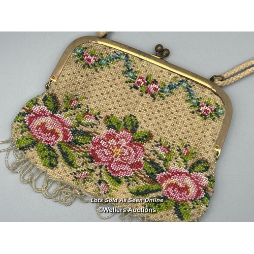 182 - Two vintage evening purses, one with embroidered flowers and metal clasp decorated with farmers and ... 