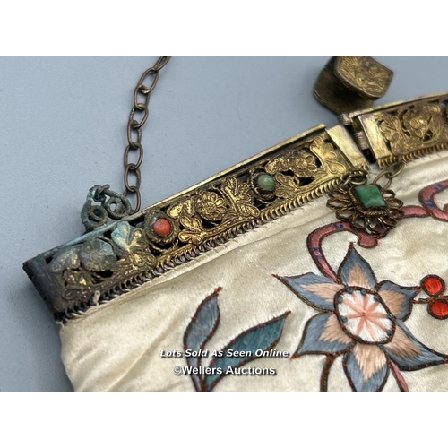 183 - A vintage silk evening purse embroidered with flowers and butterfly design, filigree brass clasp wit... 