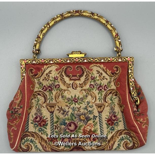 184 - A vintage embroidered evening purse with ornate yellow metal clasp and handle decorated with red and... 