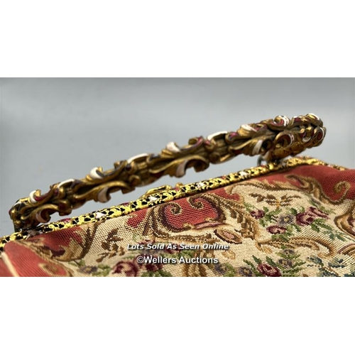 184 - A vintage embroidered evening purse with ornate yellow metal clasp and handle decorated with red and... 