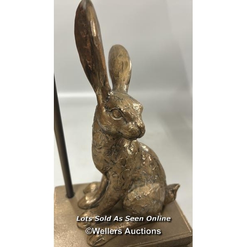 192 - A modern lamp with Rabbit on books base, untested, 56cm high including lamp shade / AN26