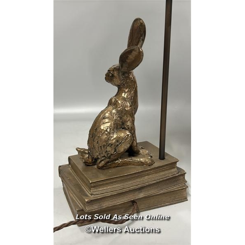 192 - A modern lamp with Rabbit on books base, untested, 56cm high including lamp shade / AN26