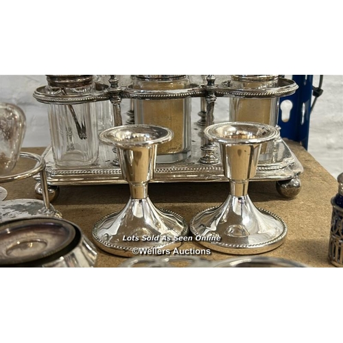 196 - Assorted silver plate including cruet set, candle holders and pierced sherry glass holders / AN17