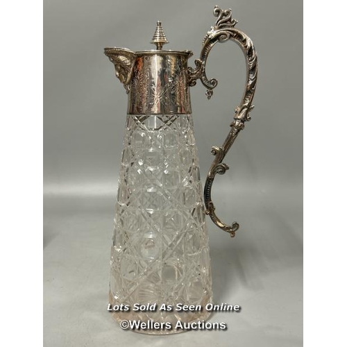 198 - A vintage silver plate and cut glass claret jug stamped A1, glass jar with ornate metal lid, placema... 