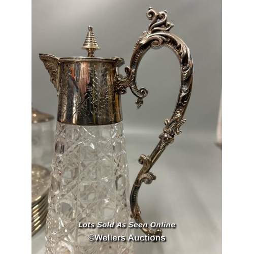 198 - A vintage silver plate and cut glass claret jug stamped A1, glass jar with ornate metal lid, placema... 