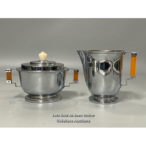 200 - Art Deco chrome plated milk jug and sugar bowl, a pair of Art Nouveau metal vase covers, small bowl ... 