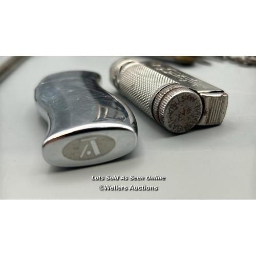 201 - Assorted items including a Bic stainless steel lighter, vintage lighter stamped Austria, Genasprin p... 