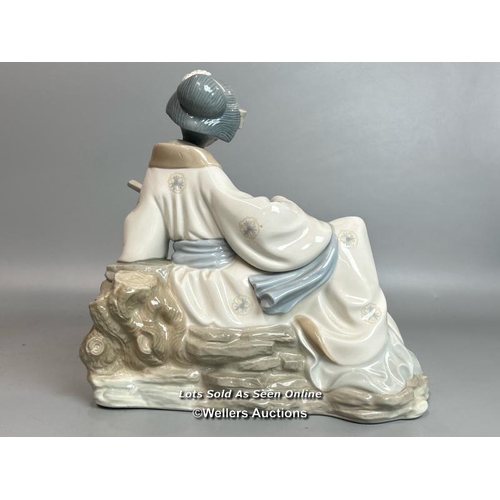 235 - A large NAO Geisha figure playing a Shamisen,  26cm high, 39cm wide / T37