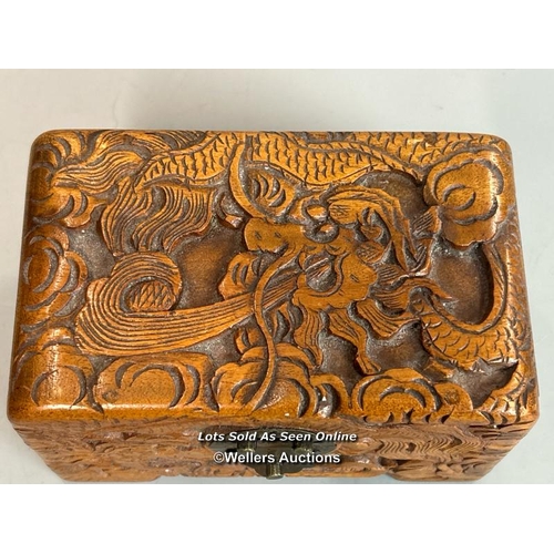 239 - Two decorative wooden boxes including a camphor wood box carved with Serpent / Sea Dragon,  plaque o... 