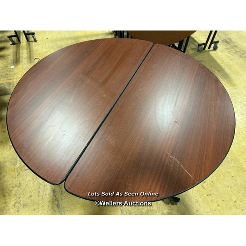 17 - Seven round folding events tables, on castors, 73cm (h) x 154cm (dia) / Buyer will be responsible fo... 