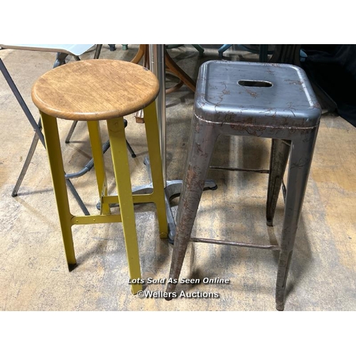 24 - Bar table and three assorted stools / Buyer will be responsible for removal, located in the large ha... 