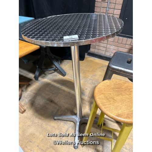 24 - Bar table and three assorted stools / Buyer will be responsible for removal, located in the large ha... 