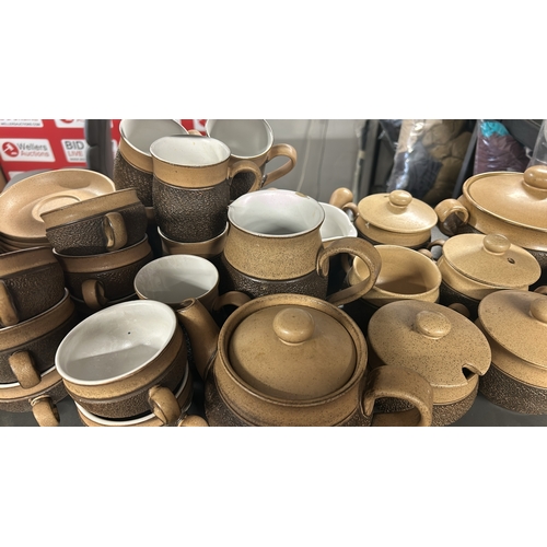 1 - A large collection of Denby 'Cotswold' stoneware tableware including tea cups, coffee cups, soup bow... 