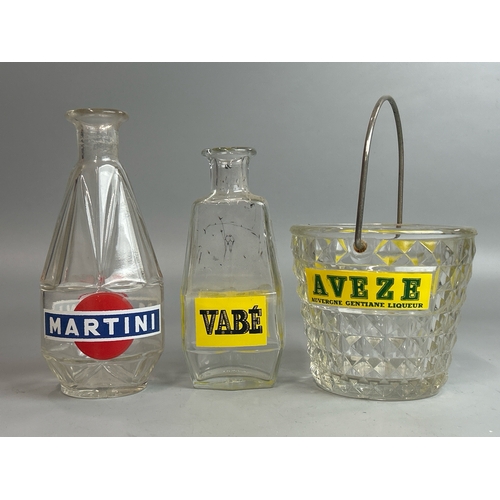 10 - Assorted vintage French advertising carafes and ice buckets including Martini, Noilly Prat, Duval an... 