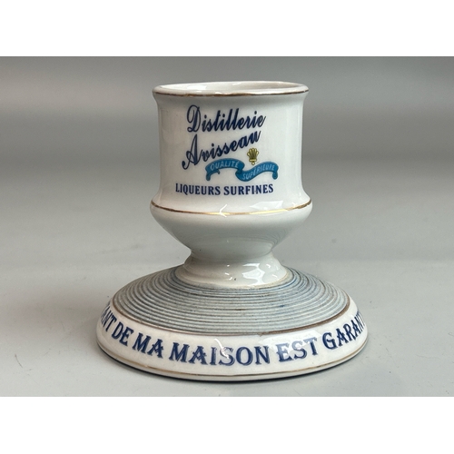 13 - A vintage french ceramic 'Pippermint Get' straw holder with two ceramic advertising match strikers i... 