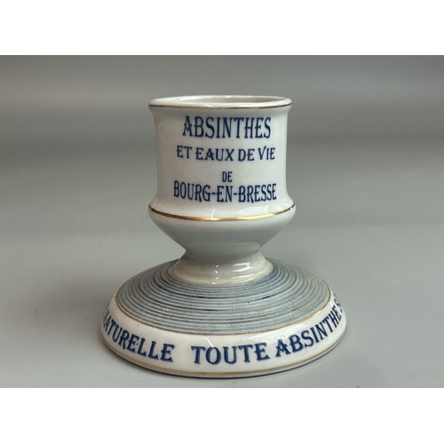 13 - A vintage french ceramic 'Pippermint Get' straw holder with two ceramic advertising match strikers i... 