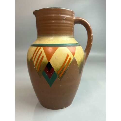 22 - A hand painted jug stamped 'Marina',23cm high, green vase stamped 'Guilford' and a small green glaze... 