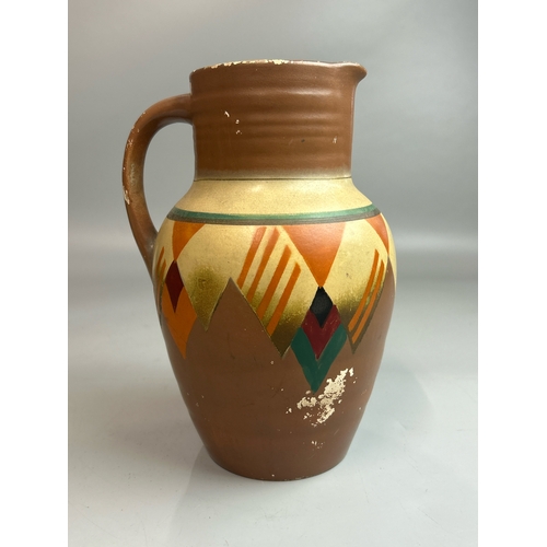 22 - A hand painted jug stamped 'Marina',23cm high, green vase stamped 'Guilford' and a small green glaze... 