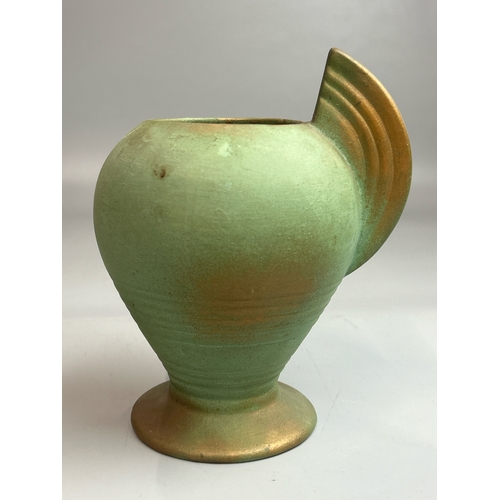 22 - A hand painted jug stamped 'Marina',23cm high, green vase stamped 'Guilford' and a small green glaze... 