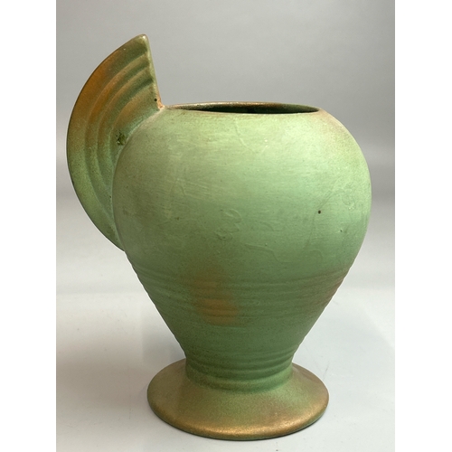 22 - A hand painted jug stamped 'Marina',23cm high, green vase stamped 'Guilford' and a small green glaze... 