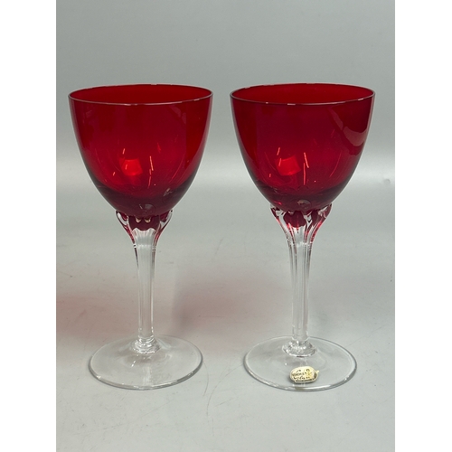 42 - Assorted red / cranberry glassware including wine glasses by Bohemia, sherry and port glasses, jugs ... 