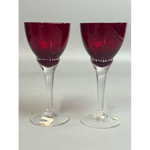 42 - Assorted red / cranberry glassware including wine glasses by Bohemia, sherry and port glasses, jugs ... 