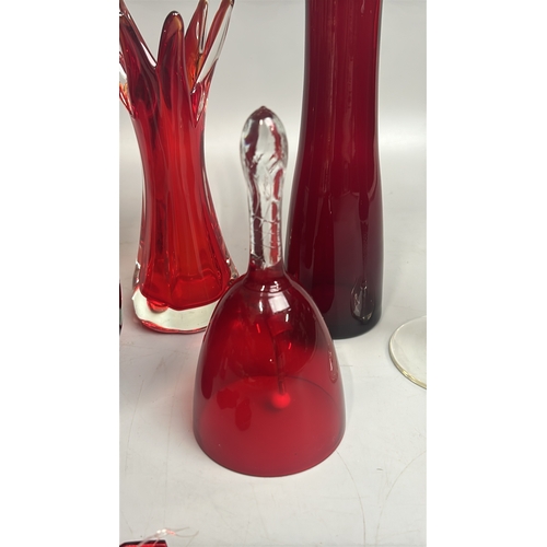 43 - Assorted red / cranberry glassware including vases, candle holder, bell and bottles / AN8