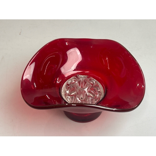 47 - A collection of red / cranberry glassware to include candle holders, vases and rose bowl (9) / AN9