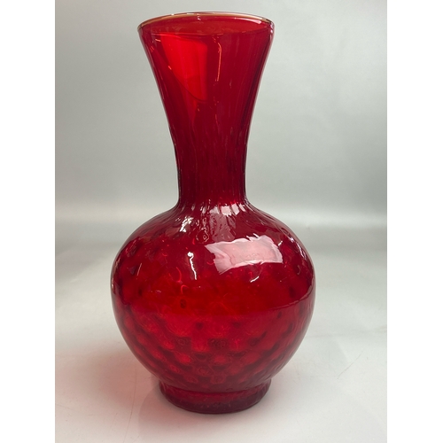 47 - A collection of red / cranberry glassware to include candle holders, vases and rose bowl (9) / AN9