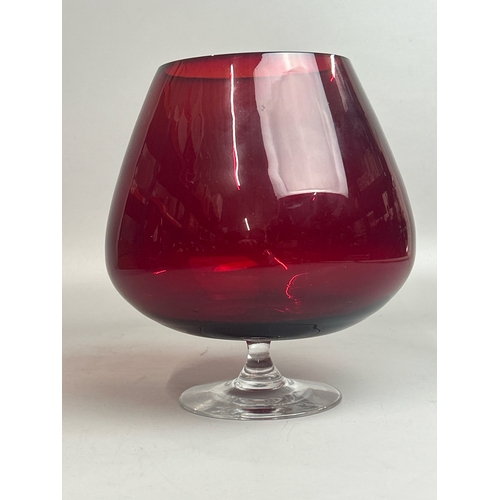 47 - A collection of red / cranberry glassware to include candle holders, vases and rose bowl (9) / AN9