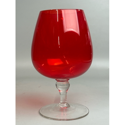 47 - A collection of red / cranberry glassware to include candle holders, vases and rose bowl (9) / AN9