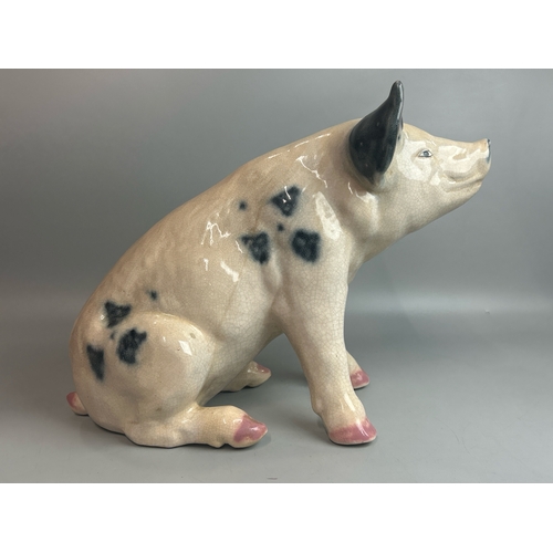 50 - A large porcelain model of a Pig, 32cm high, 46cm long / AN10