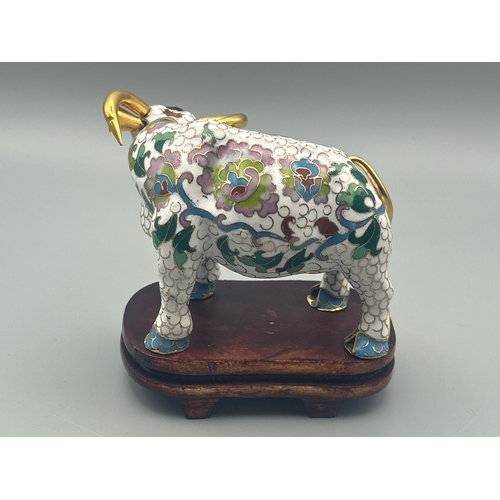 57 - A vintage cloisonne figure of a Buffalo on a carved wood stand , 6cm high / AN17