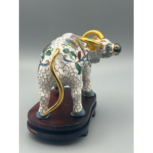 57 - A vintage cloisonne figure of a Buffalo on a carved wood stand , 6cm high / AN17