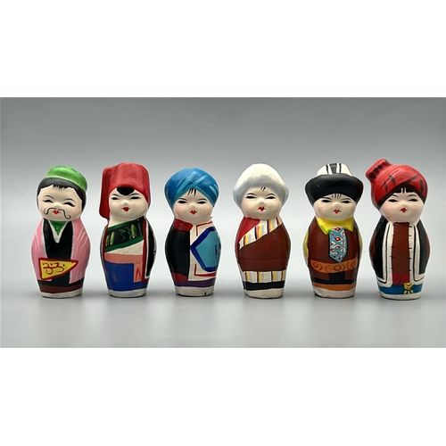 61 - Six small hand painted clay dolls, all around 5cm high / AN17