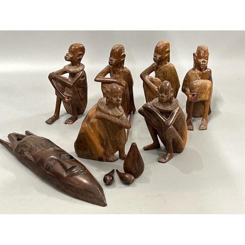 62 - Six carved African tribe figurines including three gourds and one speer, tallest 15 cm high with a d... 